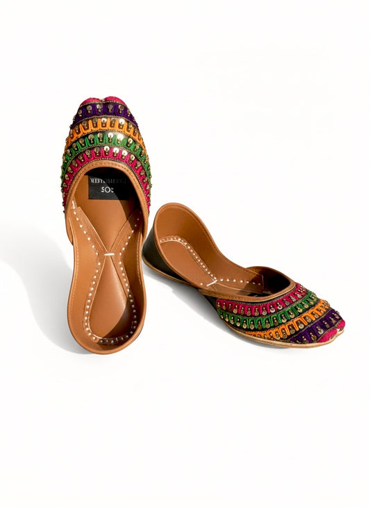 Pair of Black Phulkari Kasuri Jutti on a white background