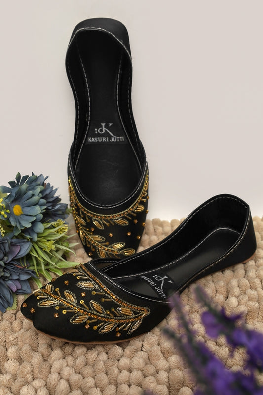 Onyx Vine Kasuri Jutti in elegant black with luxurious golden vine embroidery and beadwork