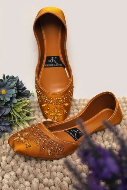 Golden Topaz Yellow Kasuri Jutti with sparkling crystal and gold embroidery, one standing, one flat