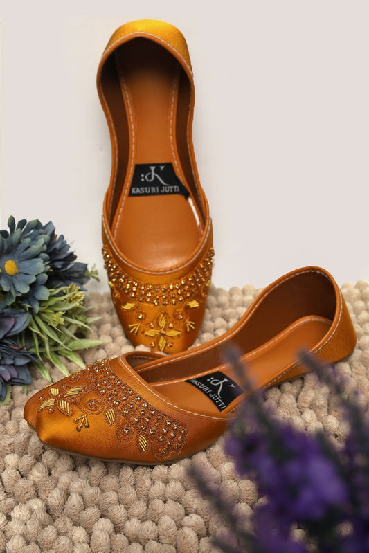 Golden Topaz Yellow Kasuri Jutti with sparkling crystal and gold embroidery, one standing, one flat