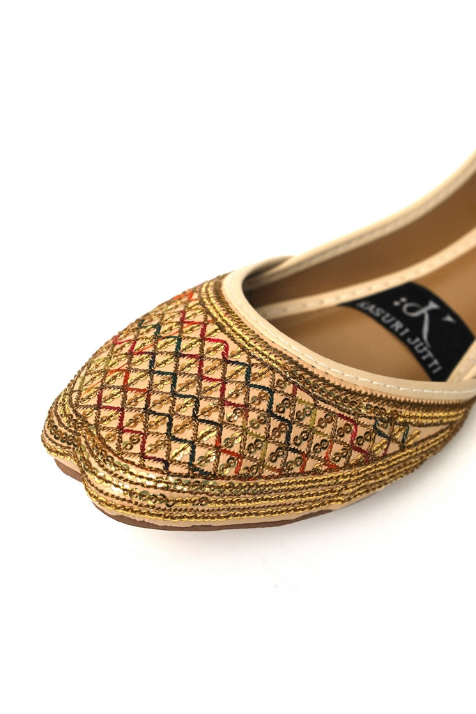 Desert Diamond Kasuri Jutti Punjabi shoe with intricate patterns on a white background - closeup