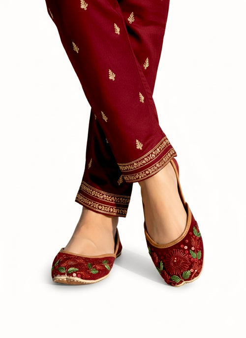 Maroon embroidered traditional pants and Red Floral Kasuri Jutti on a white background