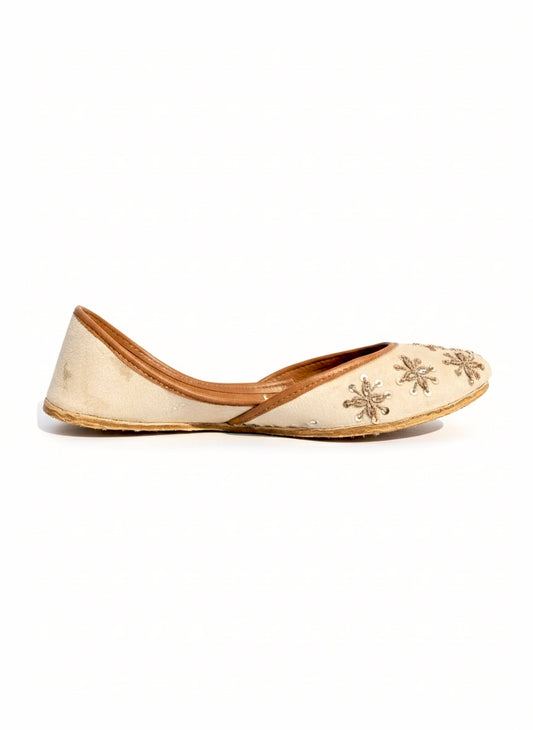 Tilla Work Kasuri Jutti with floral embroidery on a white background