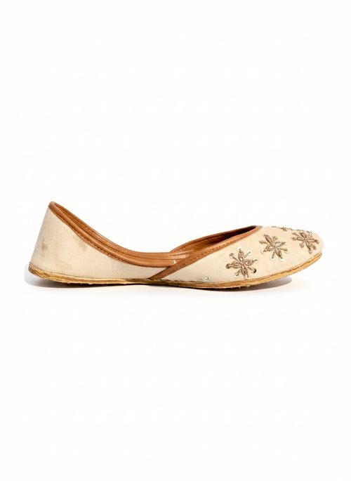 Tilla Work Kasuri Jutti with floral embroidery on a white background