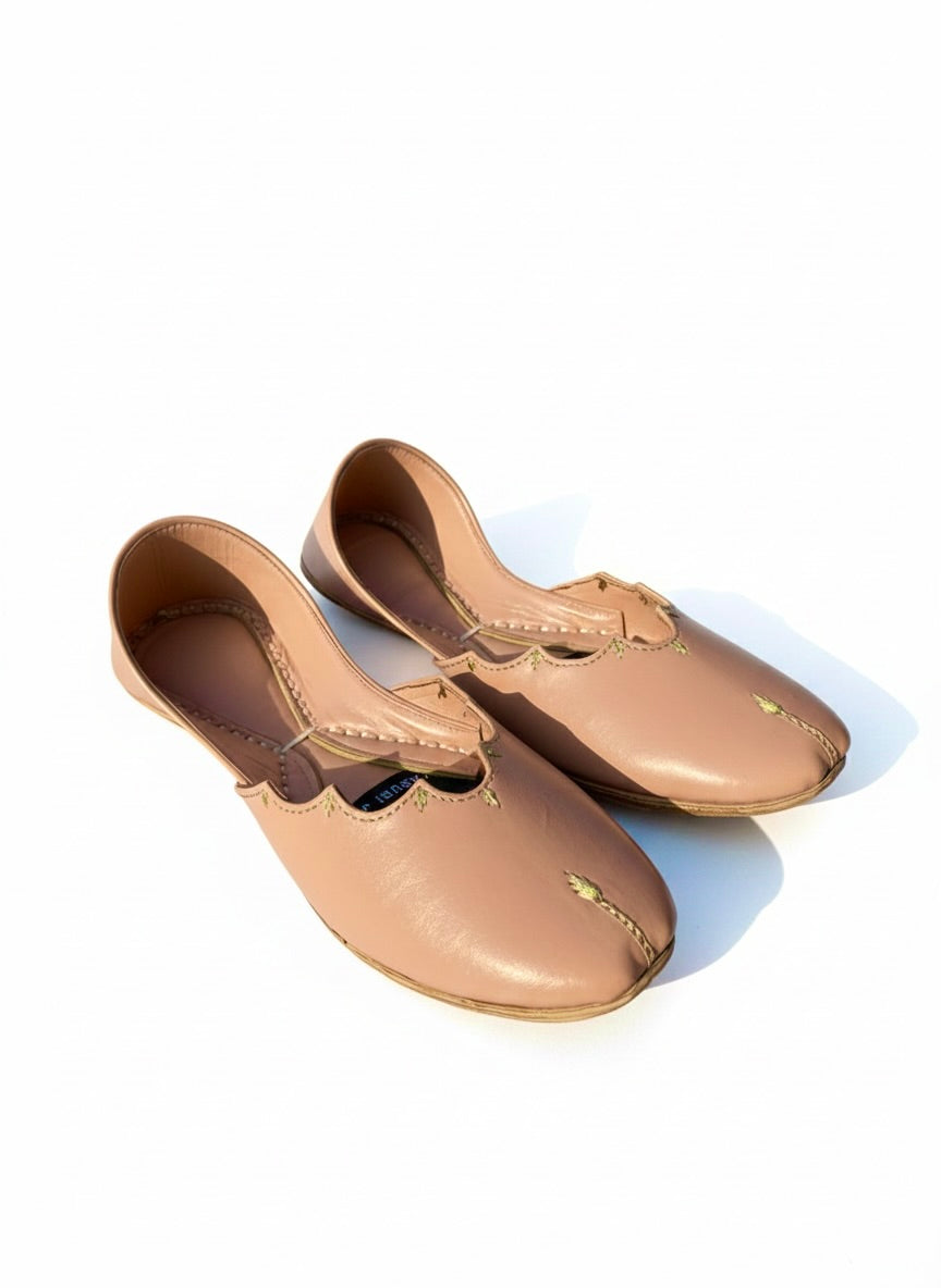 Pair of plain beige Kasuri jutti front view