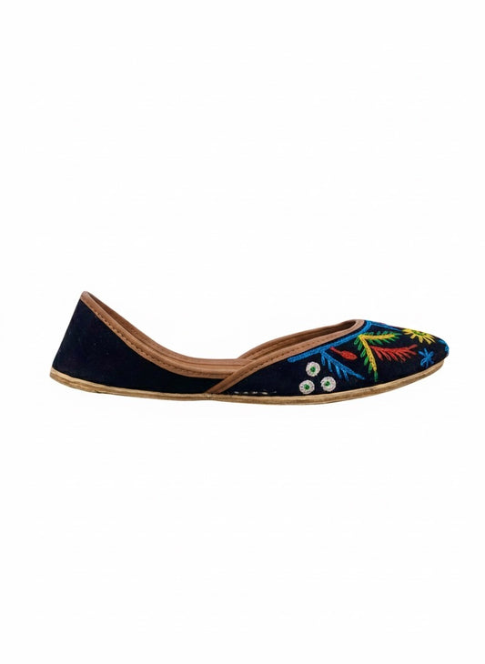 Side view of black Kasuri jutti with colorful flower design
