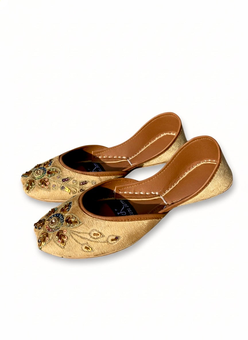 Light golden Kasuri jutti pair showing bead and stone flower design