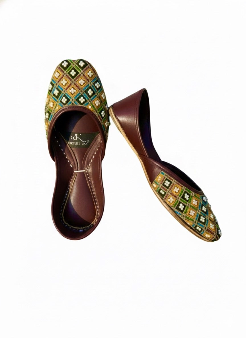 Multi color Kasuri jutti pair standing on heels to show pattern
