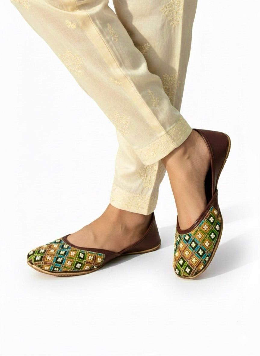 Multi color Kasuri jutti with bead work worn with cream shalwar